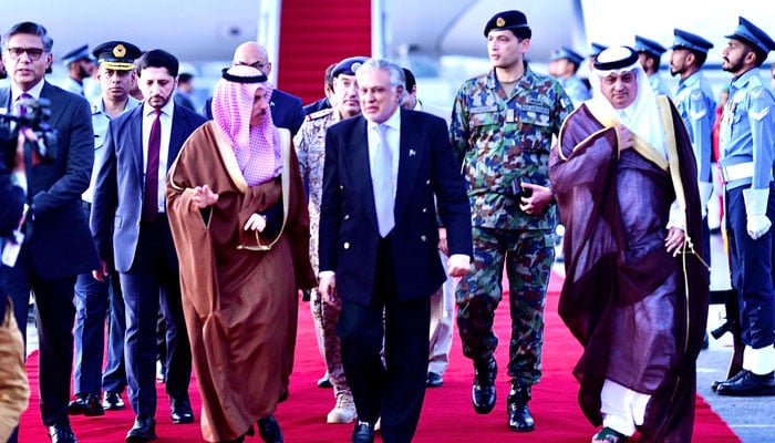 Foreign Minister Ishaq Dar (centre) receives his Saudi Arabian counterpart Prince Faisal Bin Farhan Al Saud (left) at Nur Khan Airbase Rawalpindi on April 15, 2024. — PID