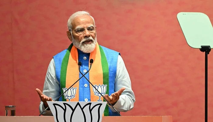 Indias Prime Minister Narendra Modi speaks after revealing the Bharatiya Janata Partys (BJP) manifesto ahead of countrys upcoming general elections, at the party headquarters in New Delhi on April 14, 2024. — AFP