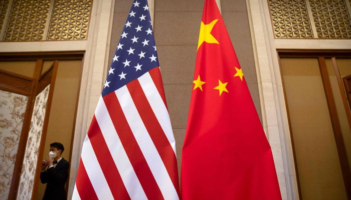 US and Chinese flags are seen at the Diaoyutai State Guesthouse in Beijing on July 8, 2023. — AFP