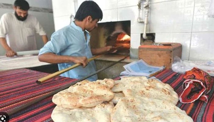 This representational image shows a naanbai making bread in shop. — Islamabad Post/File