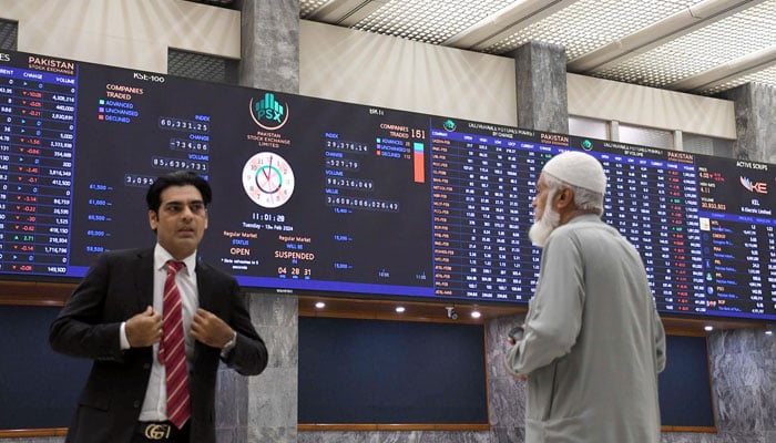 Stock brokers watch share prices during a trading session at the Pakistan Stock Exchange (PSX) in the Provincial Capital on February 13, 2024. — Online