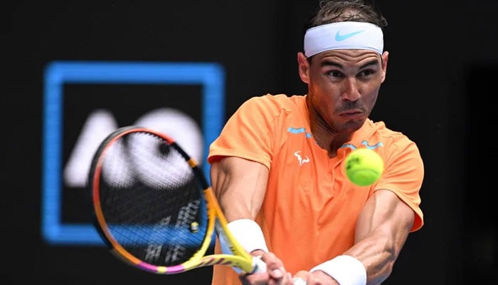 Spains Rafael Nadal hits a return against Britain´s Jack Draper during their men´s singles match on day one of the Australian Open tennis tournament in Melbourne on January 16, 2023. — AFP