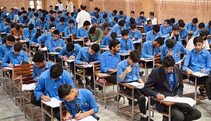 Students attempting the Matriculation (Matric) paper at Government High School No. 2 as the Secondary School Certificate (SSC) exams started in Khyber Pakhtunkhwa (KP) on April 19, 2024. — APP