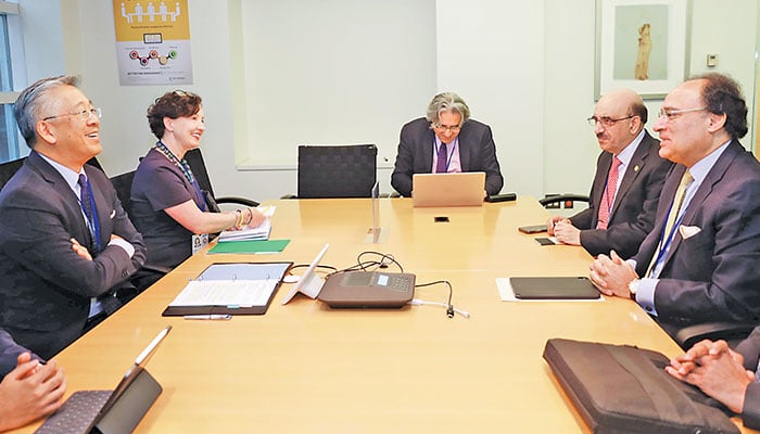 WASHINGTON: US Assistant Secretary Donald Lu and Principal Deputy Assistant Secretary Elizabeth Horst meet Finance Minister Muhammad Aurangzeb at the World Bank headquarters, Thursday. — AFP