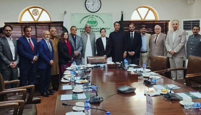 Punjab Health and Emergency Services Minister Khawaja Salman Rafique (C) pose for a group photo with a delegation of the National Centre for Healthcare Workers USA at the Department of Specialised Healthcare and Medical Education on April 19, 2024. — Facebook/Khawaja Salman Rafique