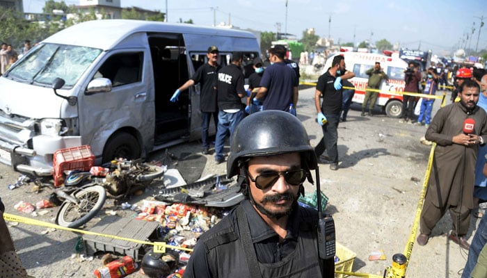View of the site while security officials are cordoned off the site for inspection and rescue operation after a suicide blast at the Landhi area in Karachi on April 19, 2024. — PPI