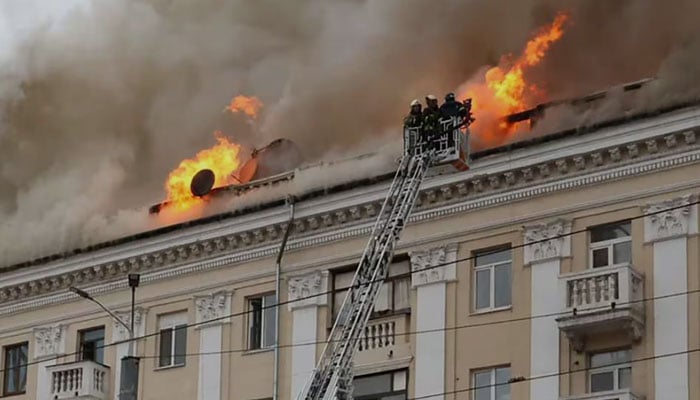 Firefighters battle flames in a building hit by a Russian strike in Dnipro, central-eastern Ukraine, on April 19, 2024. — AFP