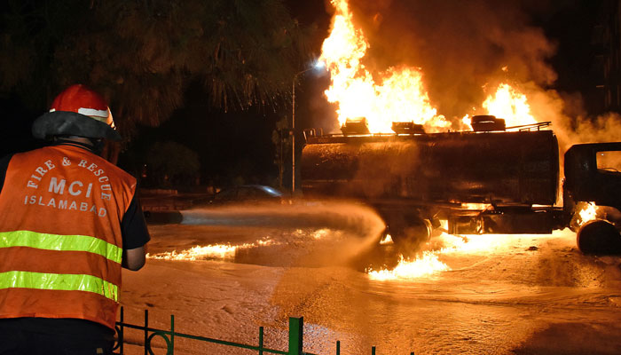 Firefighters try to extinguish a fire in an oil tanker at a fuel station in Islamabad on April 19, 2024. — Online