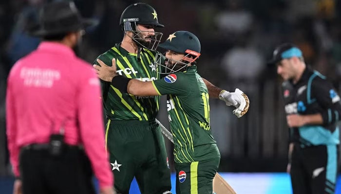 Pakistani players Mohammad Rizwan (C) and Irfan Khan Niazi congratulate each other after winning the match against New Zealand in the second T20I at the Rawalpindi Stadium on April 20, 2024. — AFP