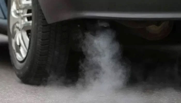 This representational image shows a vehicle emitting smoke. — AFP/File