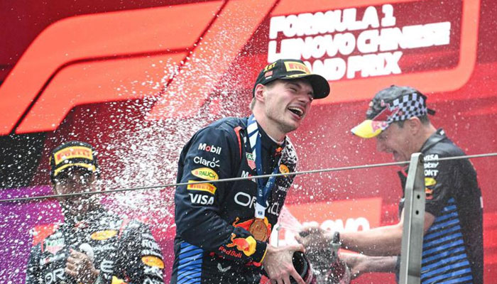 Red Bull Racings Dutch driver Max Verstappen celebrates on the podium after winning the Formula One Chinese Grand Prix at the Shanghai International Circuit in Shanghai on April 21, 2024. — AFP