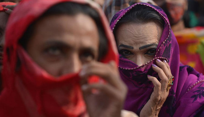 A representational image showing a transperson covering their face with a veil. — AFP/File