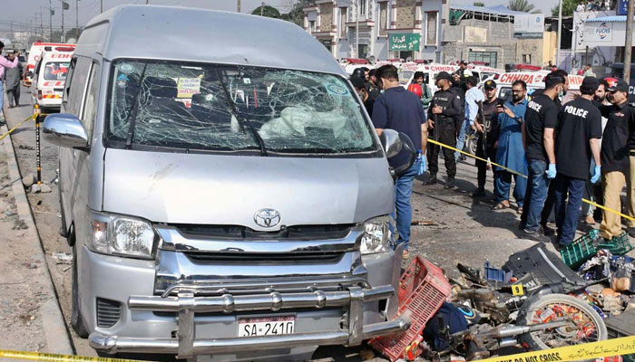 Security officials are on the spot after a suicide attack on a convoy of foreign nationals in the Landhi area on April 19, 2024. — APP