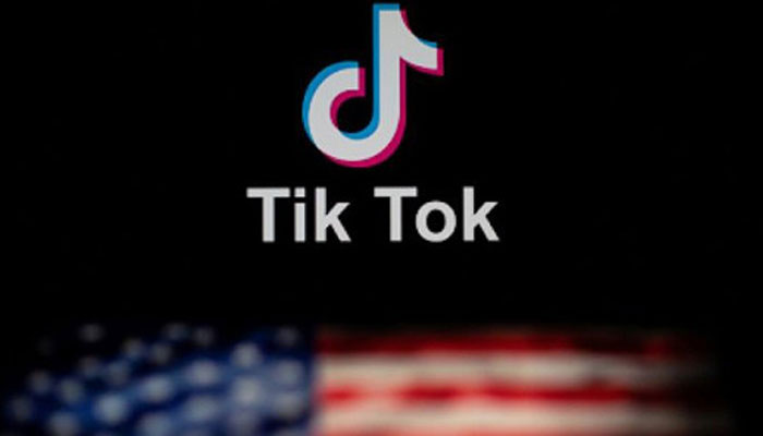 This representational image shows the TikTok logo with the shadow of the US flag. — AFP/File