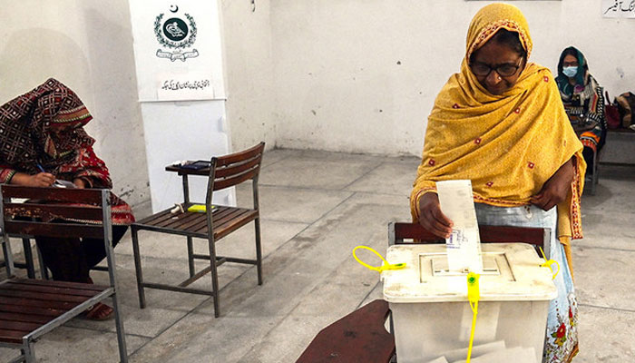 Voters cast their ballot at a polling station during the by-election in Punjab province assembly seat in Lahore. — AFP/File