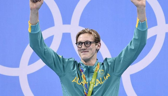 Australias Mack Horton celebrates on the podium with his gold medal after he won the Mens 400m Freestyle Final during the swimming event at the Rio 2016 Olympic Games in Rio de Janeiro on August 6, 2016. — AFP/File