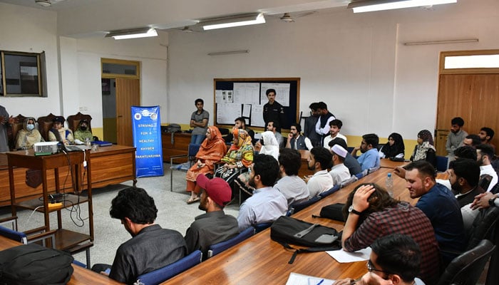 Participants attend table talks on public policy and advocacy for climate change at the University of Peshawar (UoP) on April 22, 2024. — Facebook/Centre for Disaster Preparedness & Management Peshawar (CDPM)