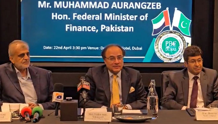 Federal Finance Minister Muhammad Aurangzeb (centre) pictured alongside President Pakistan Business Council Dubai Iqbal Dawood (left) and Consul General of Pakistan to Dubai Hussain Muhammad, as he addresses Pakistans business diaspora in Dubai on April 22, 2024. — Reporter