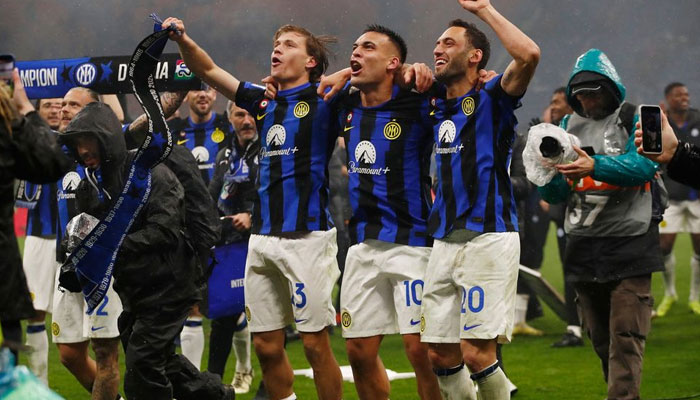 Inter Milans Nicolo Barella, Lautaro Martinez and Hakan Calhanoglu celebrate. — AFP