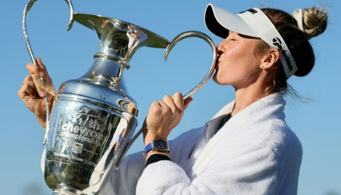 Nelly Korda, kissing the trophy after winning the Chevron Championship for her second major title and fifth win in a row, withdrew on Monday from the LA Championship. — AFP File