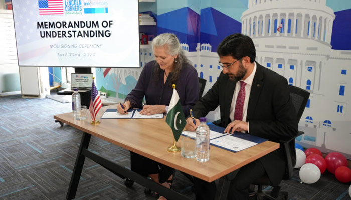 Bettina Malone, the U.S. Embassy’s Minister Counselor for Public Affairs (MCPA) (L), and Dr Usman Ghani, Director (IM Sciences) (R), sign an MOU during a signing ceremony on April 23, 2024. — U.S. EMBASSY & CONSULATES IN PAKISTAN  Website/File
