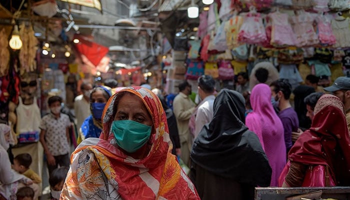 A representational image showing women at a market. — AFP/File