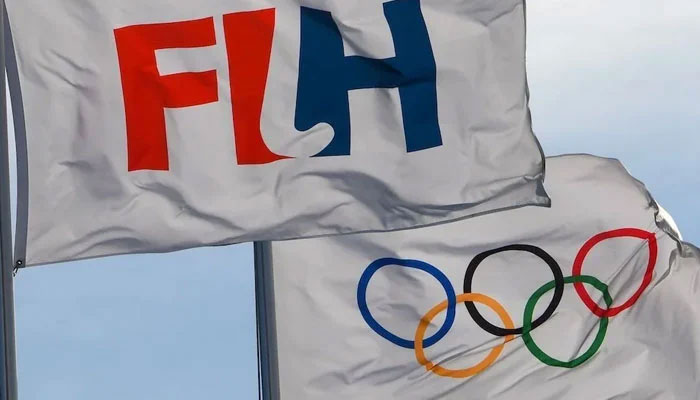 The flags of the International Hockey Federation and Olympics flutter with the air in this undated photo. — FIH