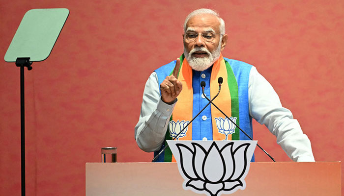 Indias Prime Minister Narendra Modi speaks after releasing the Bharatiya Janata Partys (BJP) manifesto ahead of countrys upcoming general elections, at the party headquarters in New Delhi on April 14, 2024. — AFP