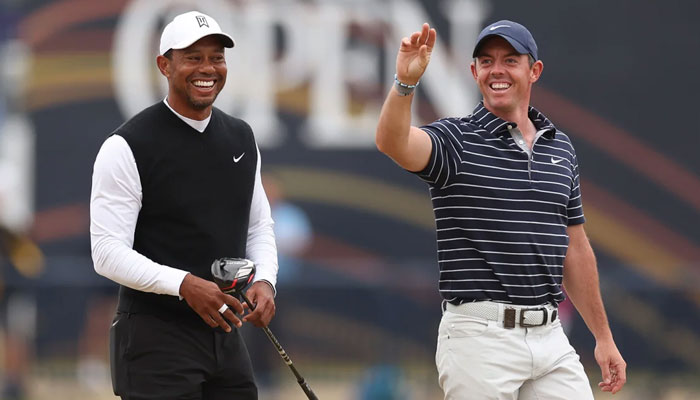 Tiger Woods (left) and Rory McIlroy.   — AFP File