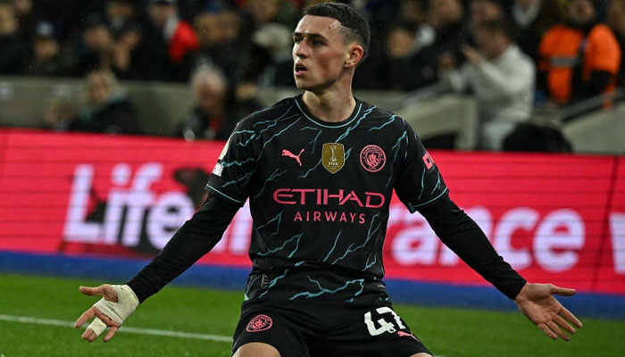 Manchester Citys English midfielder Phil Foden celebrates scoring the teams third goal, at the American Express Community Stadium in Brighton, southern England on April 25, 2024. — AFP