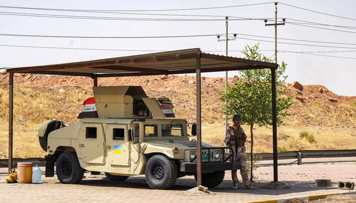 A Humvee vehicle of the Iraqi security forces stationed at a checkpoint along a road in Iraqs multi-ethnic northern city of Kirkuk on September 5, 2023. — AFP