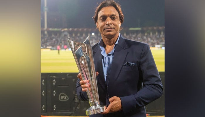 Pakistans former pacer and veteran cricketer Shoaib Akhtar poses with the ICC T20 World Cup 2024 Trophy at Lahores Ghaddafi Stadium on April 27, 2024. — X@@TheRealPCB