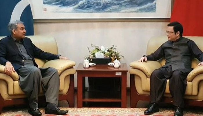 Interior Minister Mohsin Naqvi (left) meets Chinese Consul General Zhao Shiren. — APP/File