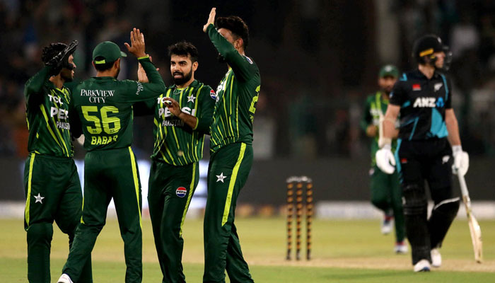 Pakistani players celebrate during the Fifth Twenty20 International cricket match between Pakistan and New Zealand at the Qaddafi cricket stadium on April 27, 2024. — APP
