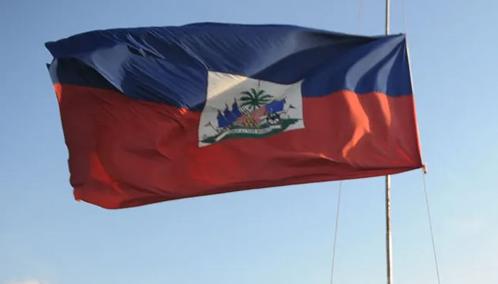 The Haitian flag is hoisted against a clear sky at the site of the presidential palace, Port-au-Prince, Haiti. — AFP/File
