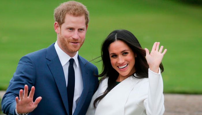Prince Harry and his wife Meghan Markle gestures in this image. — AFP/File