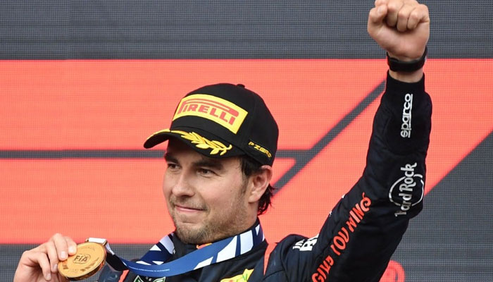 Red Bull Racings Mexican driver Sergio Perez celebrates on the podium after winning the Formula One Azerbaijan Grand Prix at the Baku City Circuit in Baku on April 30, 2023. — AFP