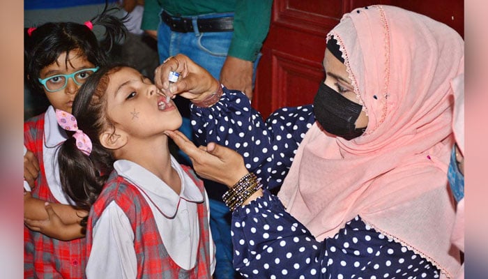 A Polio worker administers polio drops to children at a local school during an anti-polio vaccination campaign in Hyderabad on April 29, 2024. — APP