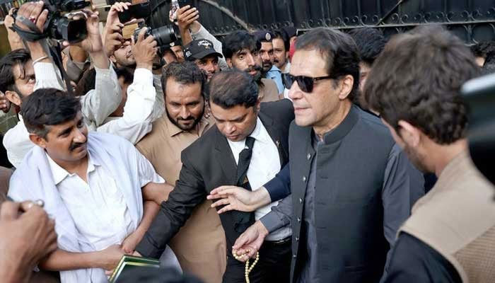 Former prime minister and PTI founder Imran Khan coming out of an Islamabad court after a hearing. — APP/File
