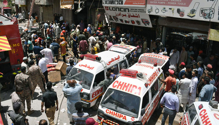 Rescue workers and volunteers engage in rescue efforts following a gas cylinder explosion at Generator Market on April 30, 2024. — APP