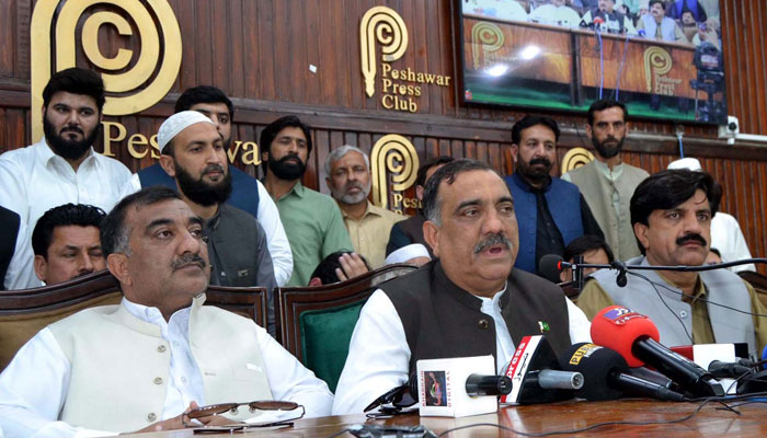 PML-N leader, Malik Tariq Awan (C) addresses media persons during a press conference, at the Peshawar Press Club on April 30, 2024. — PPI