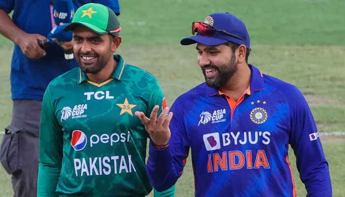 Representational image of Pakistans skipper Babar Azam (left) and Indian captain Rohit Sharma are seen smiling together during Asia Cup 2022. — AFP/File
