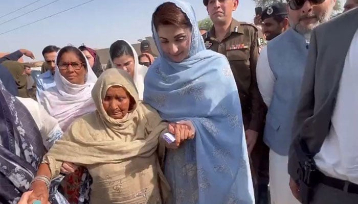 Punjab CM Maryam Nawaz helps an elderly woman walk during her Bahawalpur visit on May 1, 2024. — Screengrab/X/@MaryamNSharif