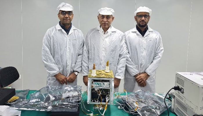 Scientists pose with ICUBE-Qamar (ICUBE-Q) which is set to be launched into the lunar orbit aboard China’s Chang’E-6 Mission from Wenchang space launch site in this undated picture. — IST website/File