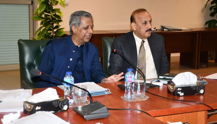 Federal Minister for Law and Justice Azam Nazeer Tarar (left) and Federal Secretary for the Ministry of Human Rights AD Khwaja speak at an event. — PID/File