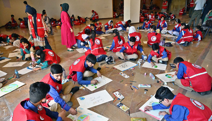 Students participate in an Arts & Painting Competition under the theme Keeping Humanity Alive in connection with the World Red Cross and Red Crescent Week Celebration at Citizens Club, F-9 Park on May 2, 2024. — APP