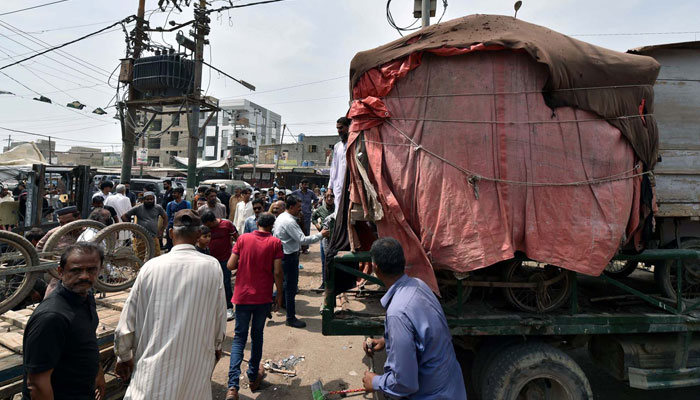 Removes illegal encroachment during anti encroachment drive under the supervision of Karachi Municipal Corporation (KMC) on  May 2, 2024. — PPI