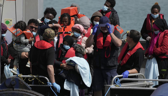 A representational image showing migrants waiting to be disembarked from a British border force vessel in Dover, England. — AFP/File