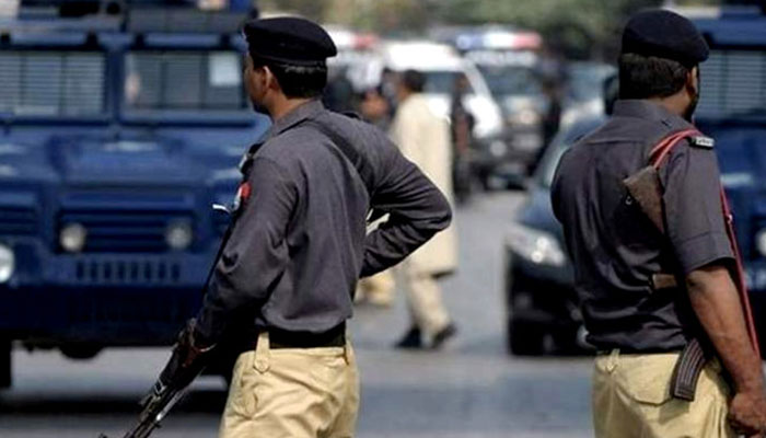 A representational image showing Sindh police personnel standing guard. — AFP/File