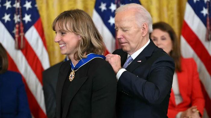 Biden gives Katie Ledecky, Michelle Yeoh Medal of Freedom